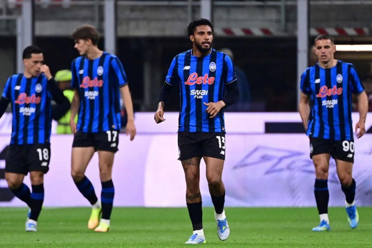Atalanta's Brazilian midfielder #13 Ederson (C) reacts after scoring his team's first goal during the Italian Serie A football match between AC Milan and Atalanta Bergamo at San Siro Stadium in Milan on May 10, 2026. Piero CRUCIATTI / AFP