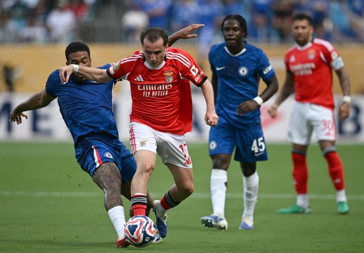Chelsea's English defender #24 Reece James and Benfica's Turkish midfielder #17 Muhammed Akturkoglu fight for the ball during the FIFA Club World Cup 2025 round of 16 football match between Portugal's Benfica and England's Chelsea at the Bank of America Stadium in Charlotte on June 28, 2025. Paul ELLIS / AFP