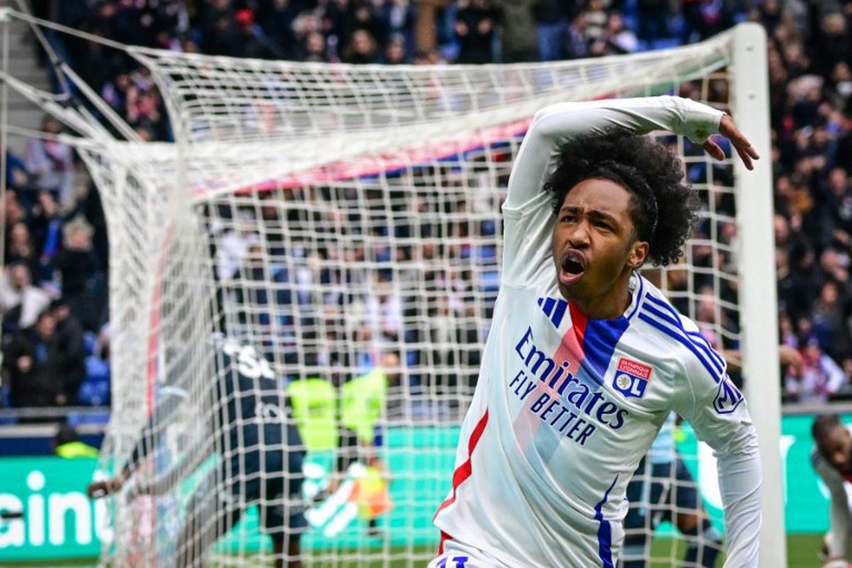 Lyon's Belgium forward #11 Malick Fofana celebrates after scoring a goal during the French L1 football match between Olympique Lyonnais (OL) and Le Havre AC at the Groupama Stadium in Decines-Charpieu, central-eastern France, on March 16, 2025. OLIVIER CHASSIGNOLE / AFP