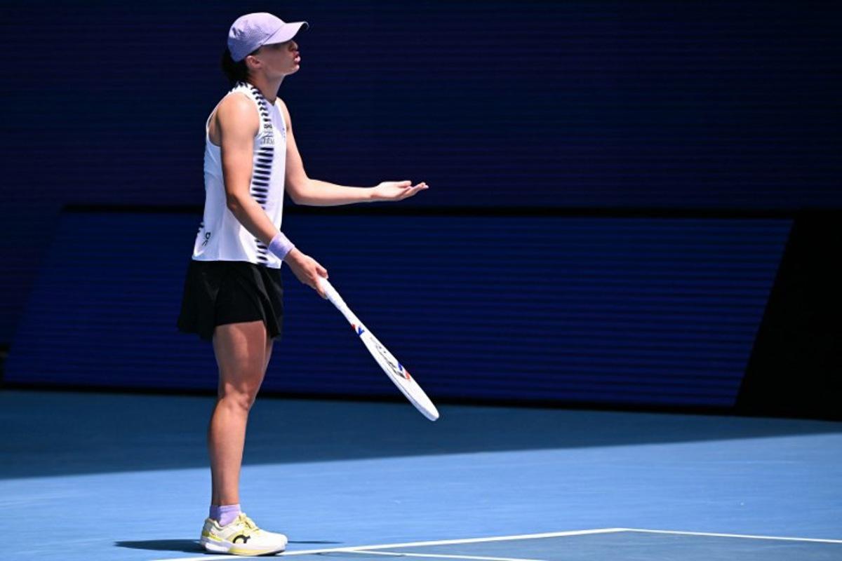 Poland's Iga Swiatek reacts on a point against Kazakhstan's Elena Rybakina during their women's singles quarter-final match on day eleven of the Australian Open tennis tournament in Melbourne on January 28, 2026. WILLIAM WEST / AFP