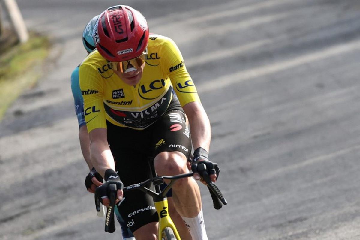 Team Visma - Lease a Bike's Danish rider Jonas Vingegaard, wearing the overall leader yellow jersey, rides in a breakaway with Bahrain - Victorious' French rider Lenny Martinez (hidden) during the 8th and final stage of the Paris-Nice cycling race, 129.2 km between Nice and Nice, on March 15, 2026. Anne-Christine POUJOULAT / AFP