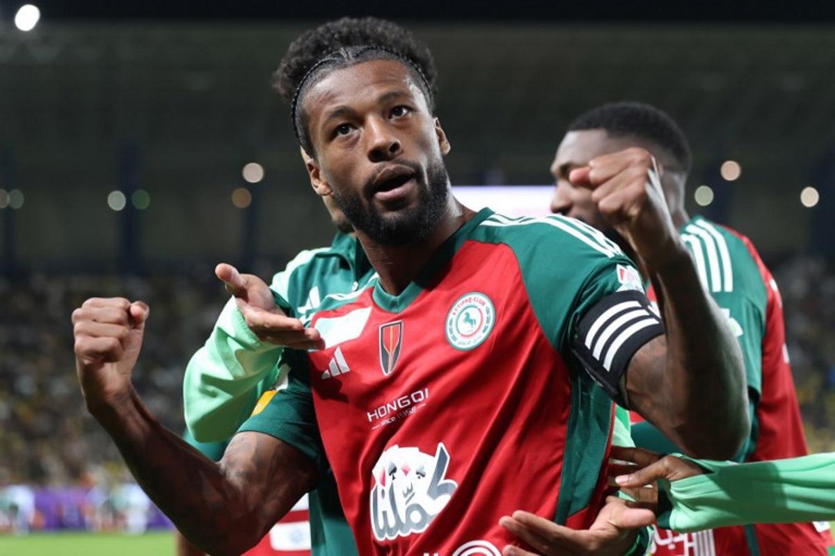 Ettifaq's Dutch midfielder #08 Georginio Wijnaldum celebrates scoring his team's third goal during the Saudi Pro League football match between Al-Nassr and Al-Ettifaq at Al-Awwal Park in Riyadh on February 21, 2025. Fayez NURELDINE / AFP