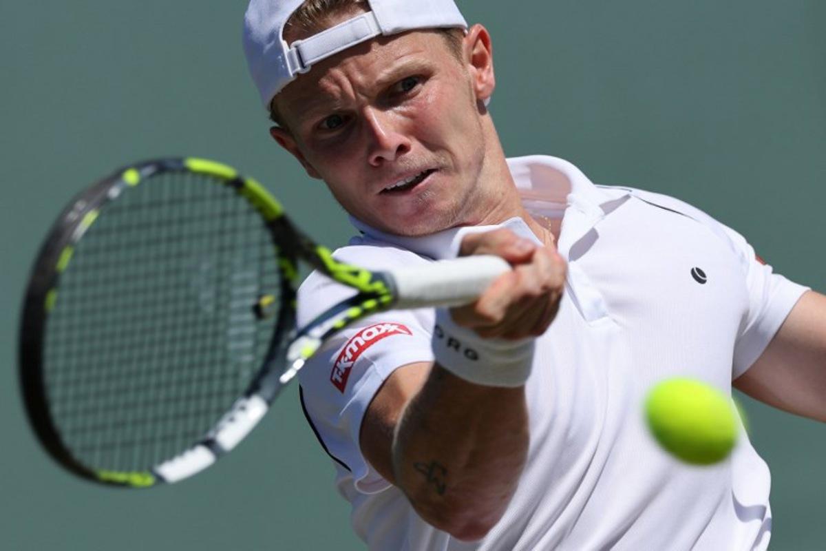 Netherlands' Jesper de Jong plays a forehand return to Serbia's Miomir Kecmanovic during their men's singles second round tennis match on the fourth day of the 2025 Wimbledon Championships at The All England Lawn Tennis and Croquet Club in Wimbledon, southwest London, on July 3, 2025. Adrian Dennis / AFP