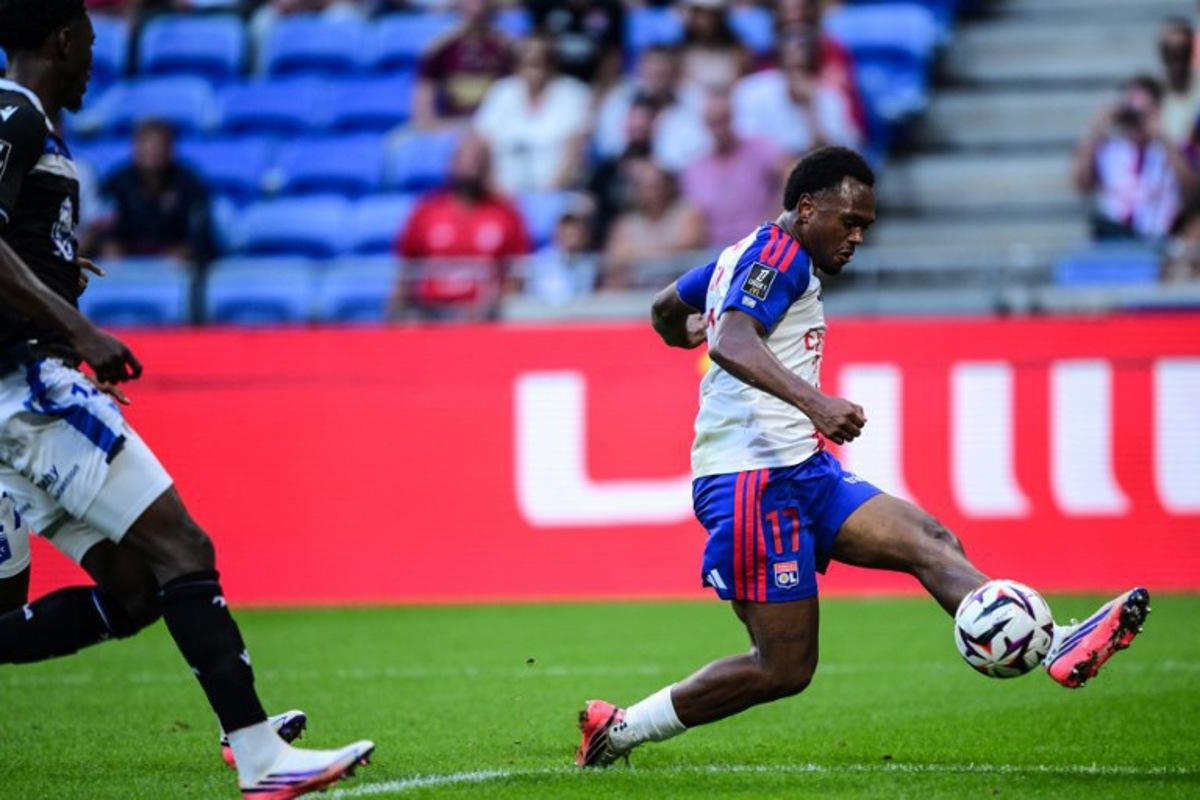 Lyon's Belgium forward #17 Lois Openda (C) shoots at the goal during the French L1 football match between Olympique Lyonnais (OL) and AJ Auxerre at the Parc Olympique Lyonnais Groupama stadium in Decines-Charpieu, central-eastern France, on September 4, 2026. OLIVIER CHASSIGNOLE / AFP