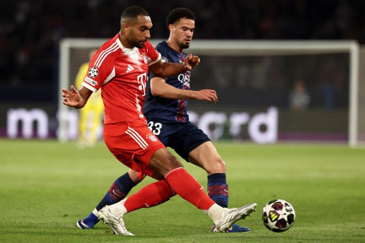 Bayern Munich's German defender #04 Jonathan Tah fights for the ball with Paris Saint-Germain's French midfielder #33 Warren Zaire-Emery during the UEFA Champions League semi-final first leg football match between Paris Saint-Germain (PSG) and Bayern Munich at the Parc des Princes in Paris on April 28, 2026. FRANCK FIFE / AFP