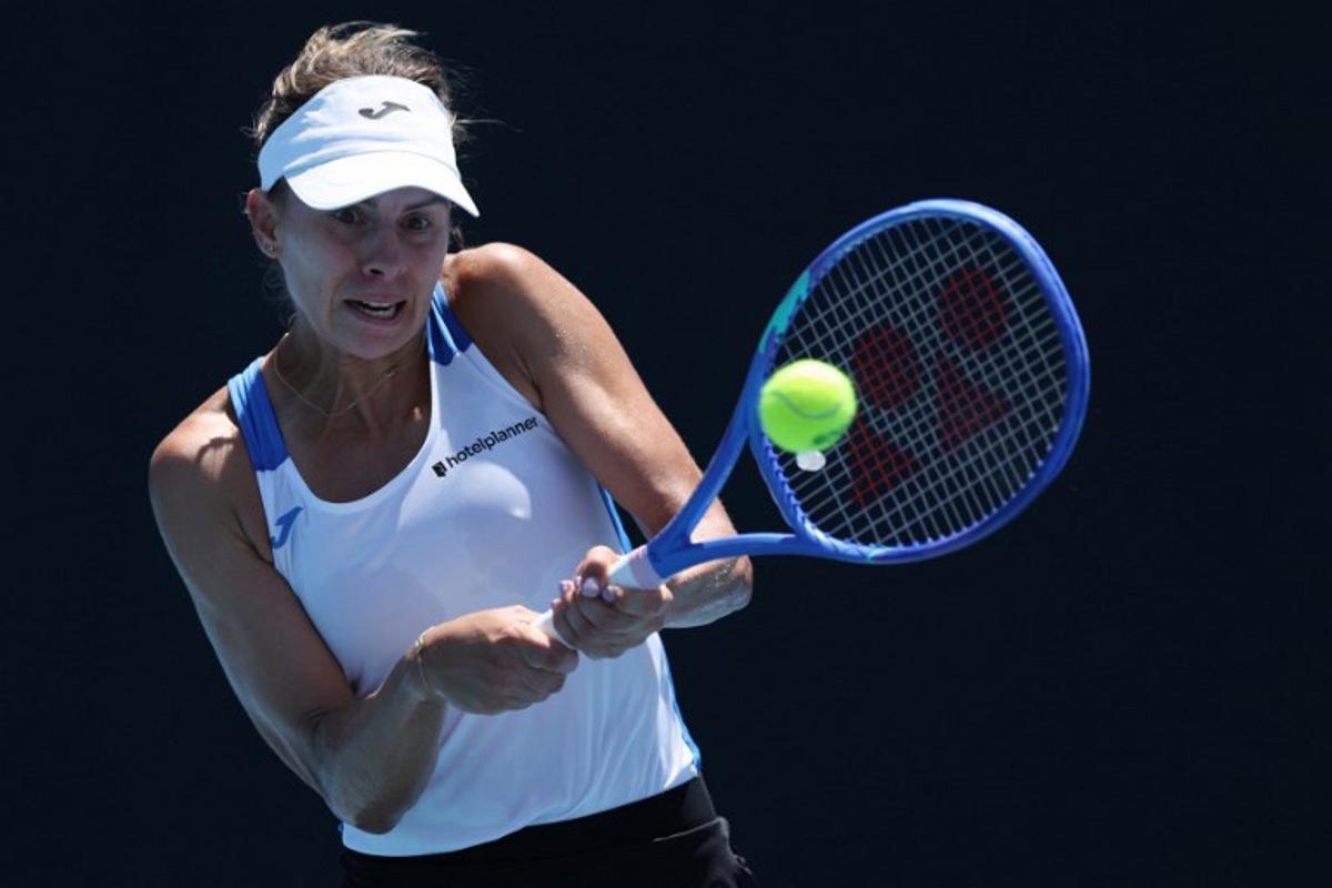 Poland's Magda Linette hits a return against Japan's Moyuka Uchijima during their women's singles match on day two of the Australian Open tennis tournament in Melbourne on January 13, 2025. Adrian Dennis / AFP