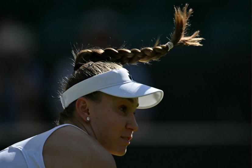 Kazakhstan's Elena Rybakina returns to France's Lois Boisson during their women's singles first round tennis match on the second day of the 2026 Wimbledon Championships at The All England Lawn Tennis and Croquet Club in Wimbledon, southwest London, on June 30, 2026. Glyn KIRK / AFP