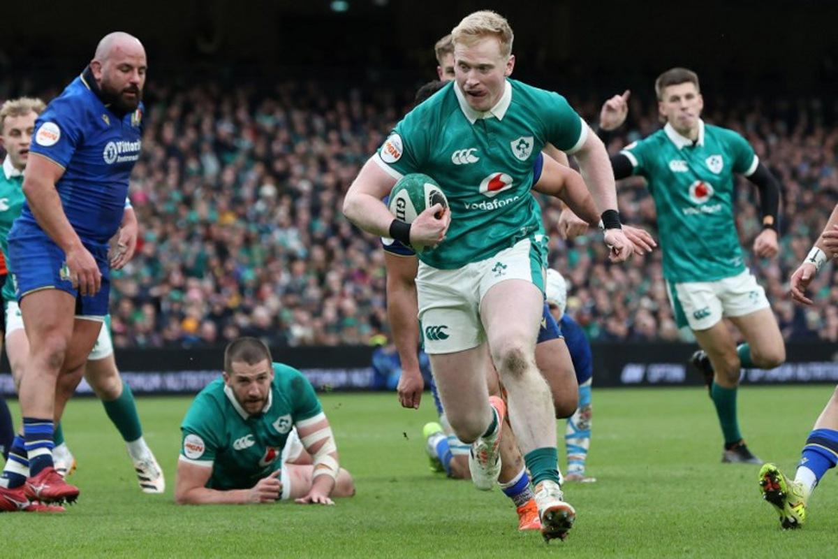Ireland's full-back Jamie Osborne runs in their first try during the Six Nations international rugby union match between Ireland and Italy at the Aviva Stadium in Dublin, on February 14, 2026. Paul Faith / AFP