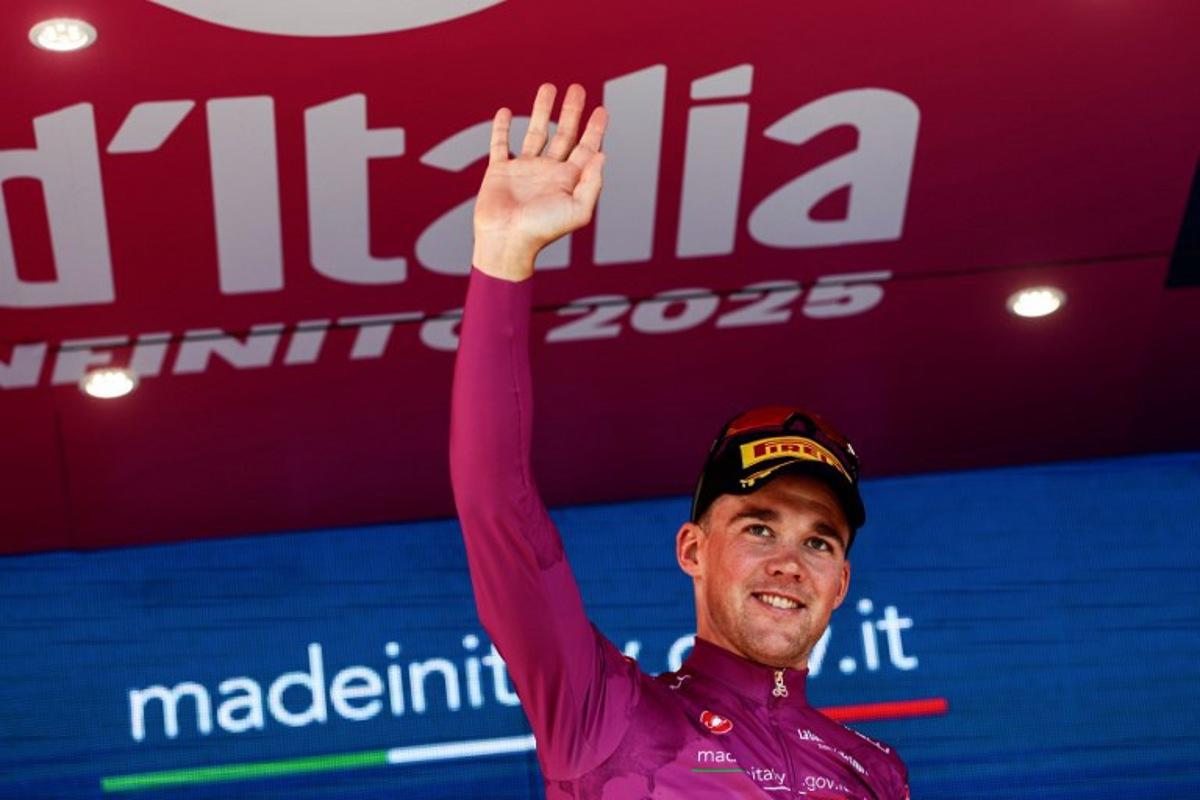 Lidl-Trek's Danish rider Mads Pedersen wearing the points classification mauve jersey (Maglia Ciclamino) poses on the podium after the second stage of the 108th Giro d'Italia cycling race, a 13.7km individual time-trial from Tirana to Tirana in Albania, on May 10, 2025. Luca Bettini / AFP