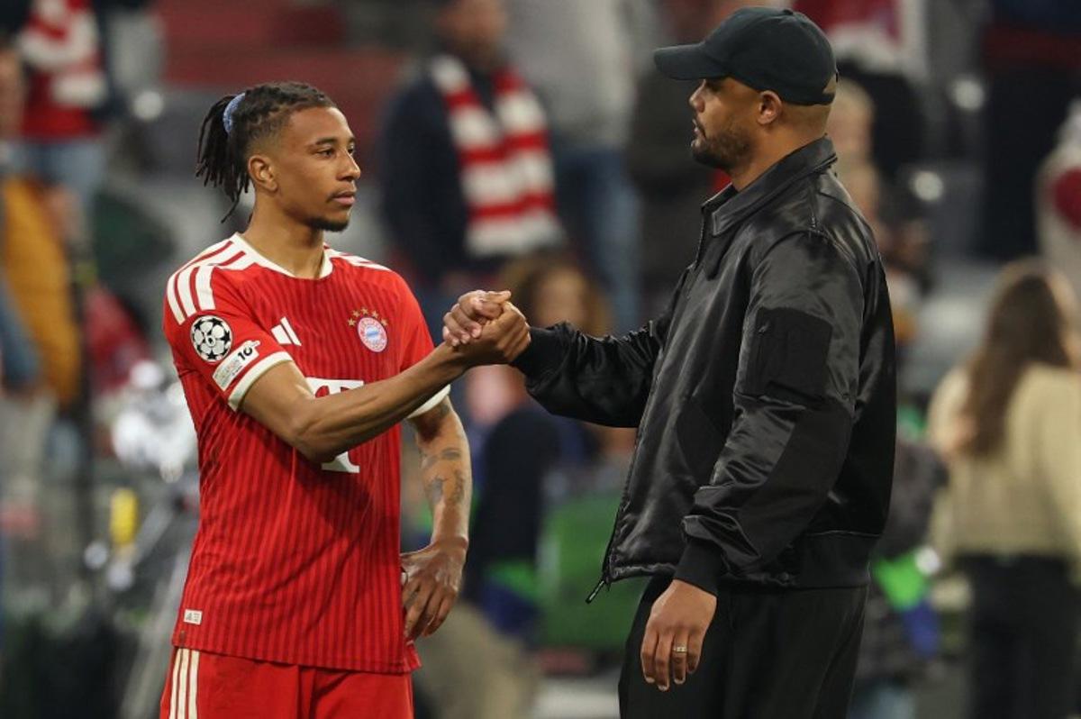 Bayern Munich's French midfielder #17 Michael Olise and Bayern Munich's Belgian head coach Vincent Kompany shake hands after the UEFA Champions League second-leg, semi-final football match between FC Bayern Munich and Paris Saint-Germain (PSG) in Munich, southern Germany on May 6, 2026. Odd ANDERSEN / AFP