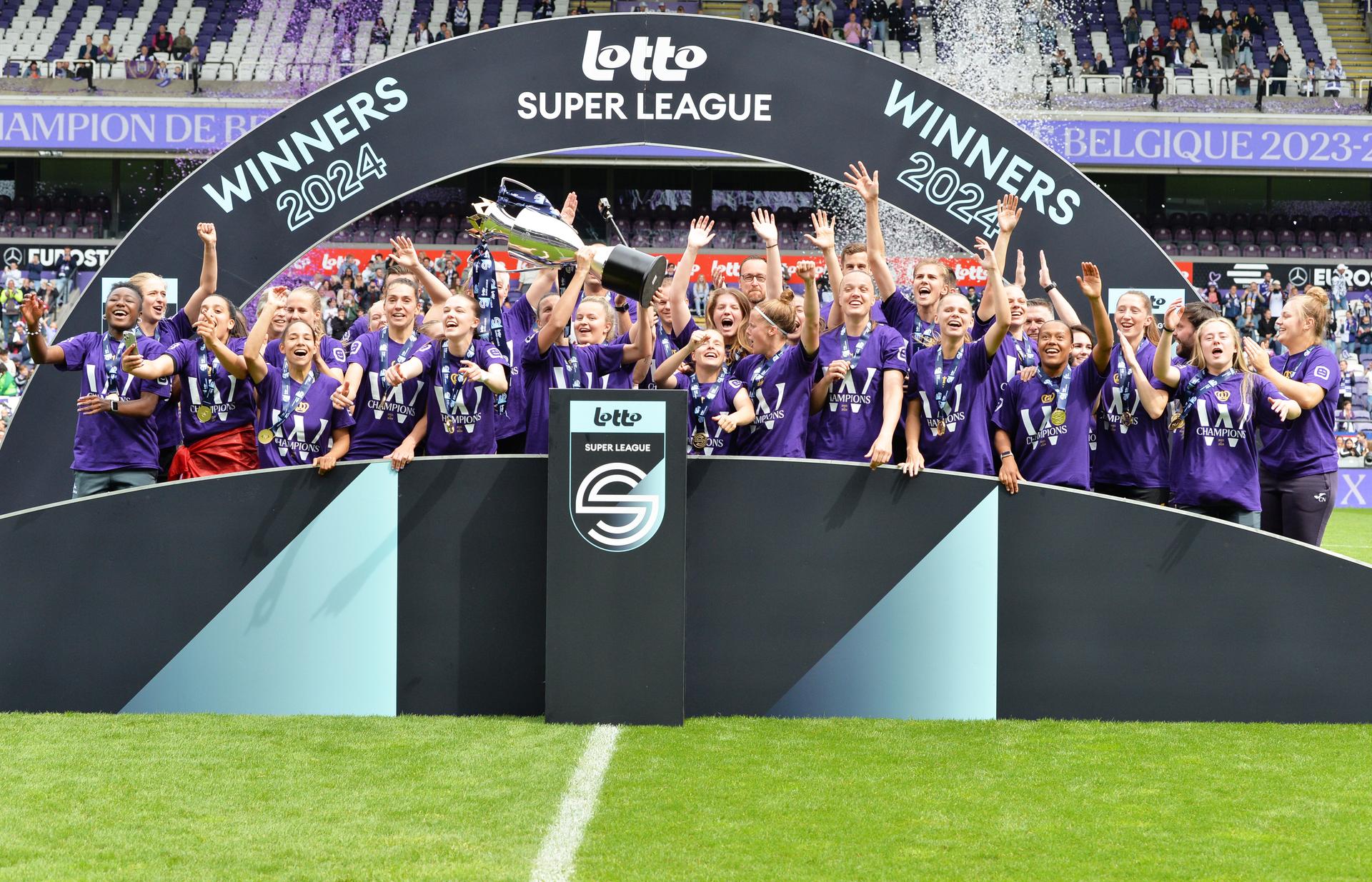 RSCA's players celebrate after winning the Super League women's championship, after a soccer game between RSCA Women and KRC Genk, Saturday 25 May 2024 in Brussels, on day 10/10 of the play-off group A of the Super League women's championship. BELGA PHOTO JILL DELSAUX
