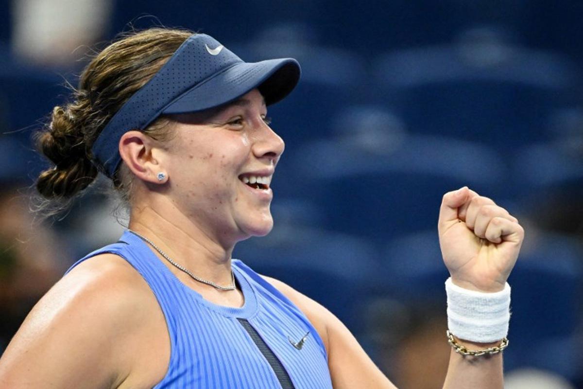 USA's Amanda Anisimova reacts after winning her women's singles quarter-final match against Italy's Jasmine Paolini at the China Open tennis tournament in Beijing on October 2, 2025. GREG BAKER / AFP
