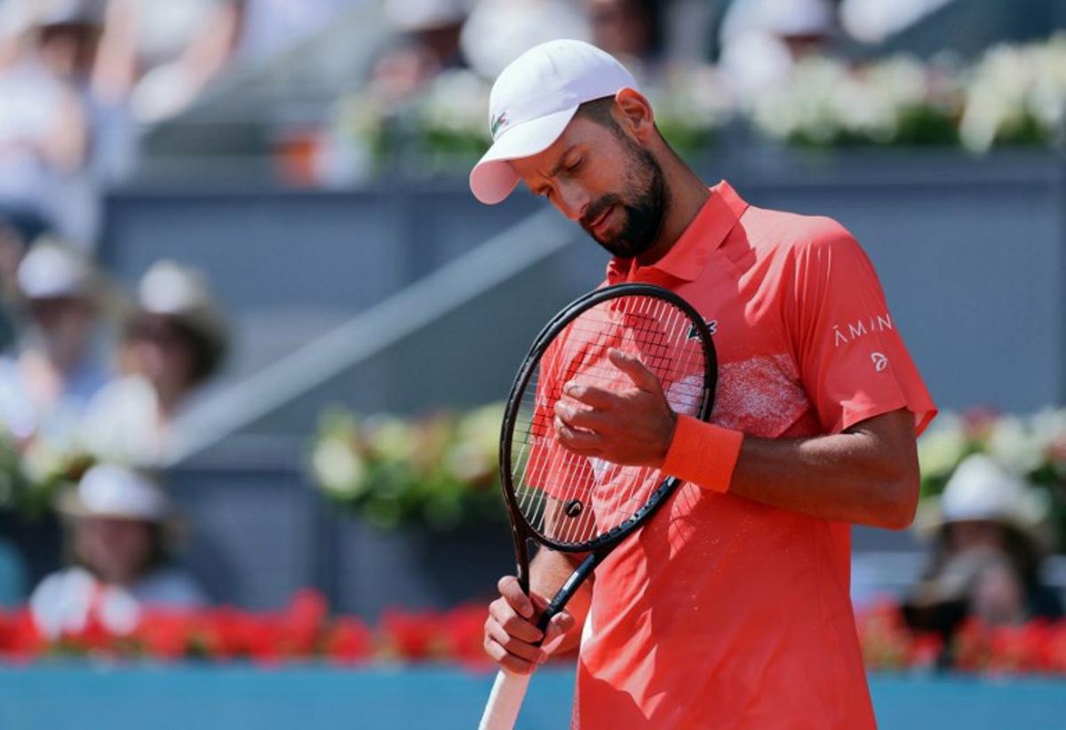 Serbia's Novak Djokovic plays against Italy's Matteo Arnaldi during their 2025 ATP Tour Madrid Open tennis tournament second round singles match at the Caja Magica in Madrid, on April 26, 2025. Thomas COEX / AFP