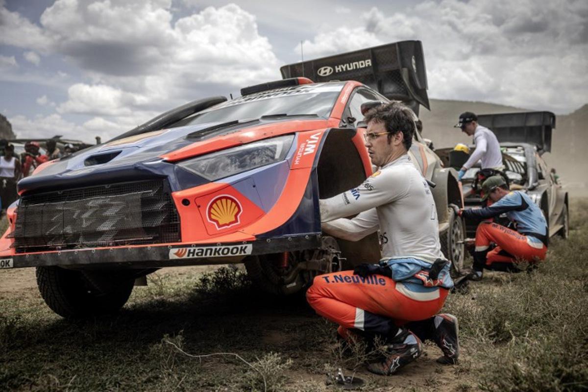 Hyundai Shell Mobis World Rally Team's Belgian driver and current World Champion Thierry Neuville works on his Hyundai i20 N Rally1 ahead of the final special stage of the World Rally Championship (WRC) Safari Rally Kenya in Naivasha on March 23, 2025. Luis TATO / AFP
