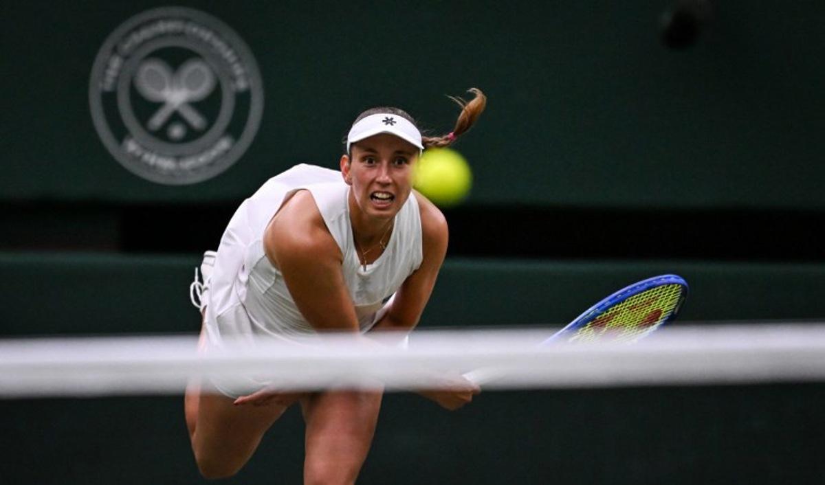 Belgium's Elise Mertens eyes the ball as she returns it to Belarus's Aryna Sabalenka during their women's singles fourth round tennis match on the seventh day of the 2025 Wimbledon Championships at The All England Lawn Tennis and Croquet Club in Wimbledon, southwest London, on July 6, 2025. Kirill KUDRYAVTSEV / AFP