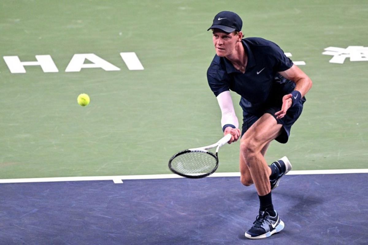 Italy's Jannik Sinner hits a return to Netherlands' Tallon Griekspoor during their men's singles match at the Shanghai Masters tennis tournament in Shanghai on October 5, 2025. Hector RETAMAL / AFP