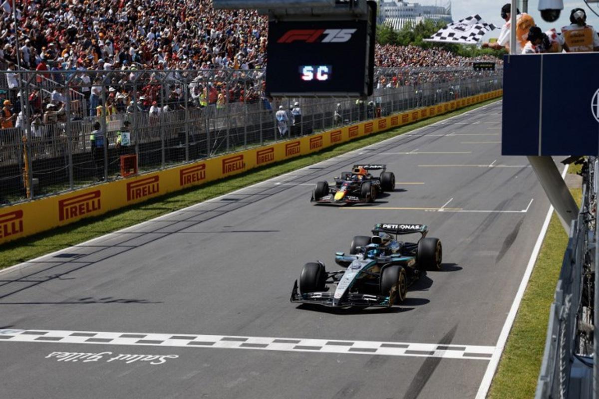 Mercedes' British driver George Russell crosses the finish line as he wins the race, followed by Red Bull Racing's Dutch driver Max Verstappen in second place, during the 2025 Formula 1 Grand Prix du Canada at Circuit Gilles-Villeneuve in Montreal, Canada, on June 15, 2025. SHAWN THEW / POOL / AFP