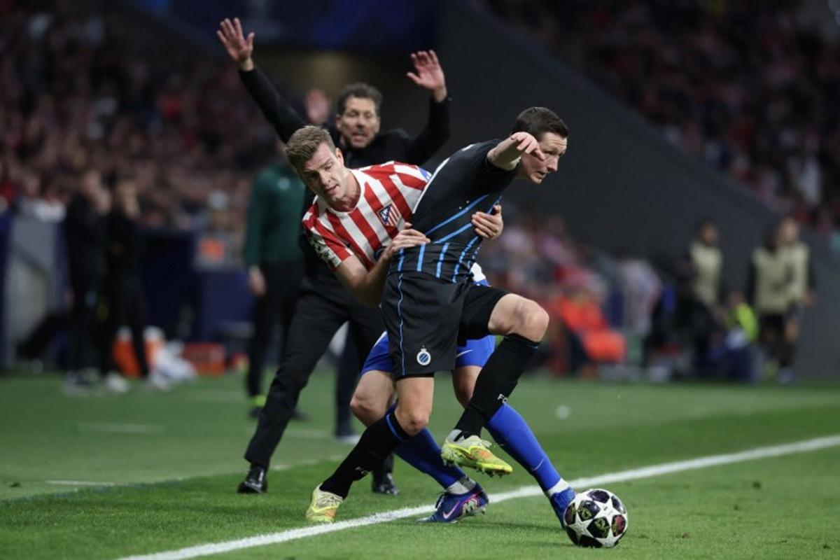 Atletico Madrid's Norwegian forward #09 Alexander Sorloth (L) vies for the ball with Club Brugge's Belgian midfielder #20 Hans Vanaken during the UEFA Champions League knockout round play-off second leg football match between Club Atletico de Madrid and Club Brugge KV at Metropolitano Stadium in Madrid on February 24, 2026. Pierre-Philippe MARCOU / AFP