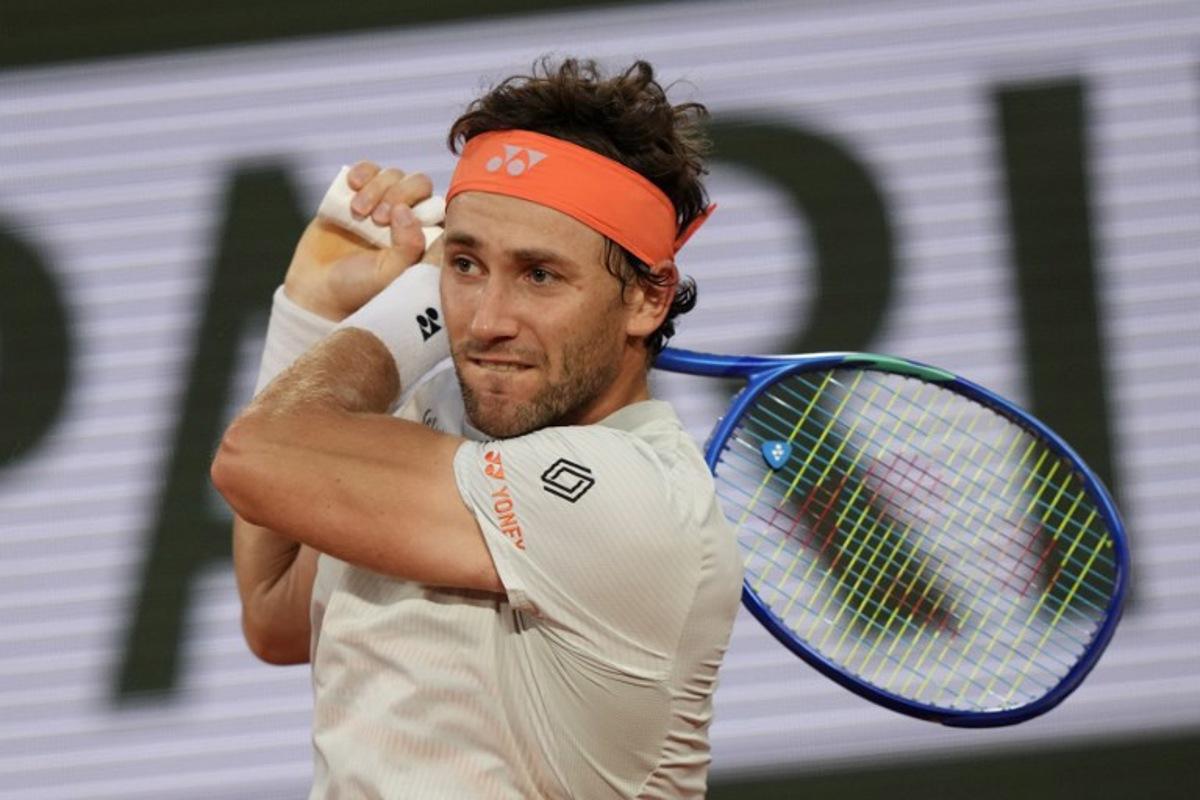 Norway's Casper Ruud plays a backhand return to Brazil's Joao Fonseca during their men's singles match on day 8 of the French Open tennis tournament on Court Philippe-Chatrier at the Roland-Garros Complex in Paris on May 31, 2026. Dimitar DILKOFF / AFP