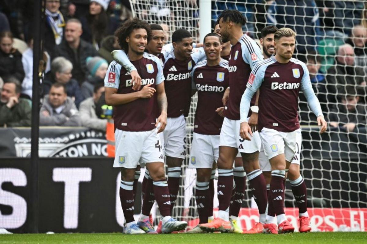 Aston Villa's English striker #09 Marcus Rashford (C) celebrates with teammates after scoring his team second goal during the English FA Cup quarter-final football match between Preston North End and Aston Villa at Deepdale stadium in Preston, north-west England on March 30, 2025. Paul ELLIS / AFP