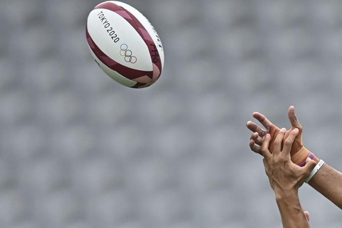 Fiji's Mele Derenalagi (R) fights for the ball with Argentina's Lucio Cinti (L) in the men's semi-final rugby sevens match between Argentina and Fiji during the Tokyo 2020 Olympic Games at the Tokyo Stadium in Tokyo on July 28, 2021. Ben STANSALL / AFP