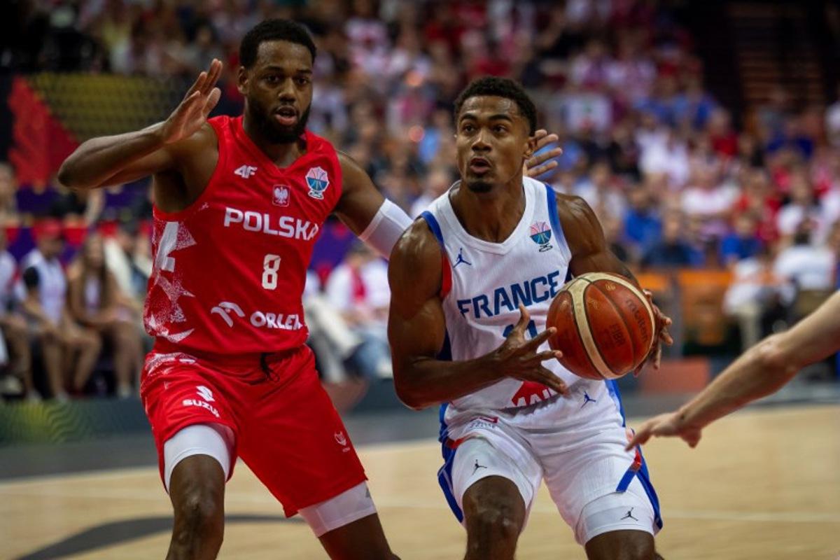 Poland's shooting guard #08 Jordan Loyd and France's point guard #11 Theo Maledon vie during the FIBA EuroBasket 2025 Group D basketball match between France and Poland at the Spodek Arena in Katowice, Poland on September 2, 2025. Wojtek RADWANSKI / AFP