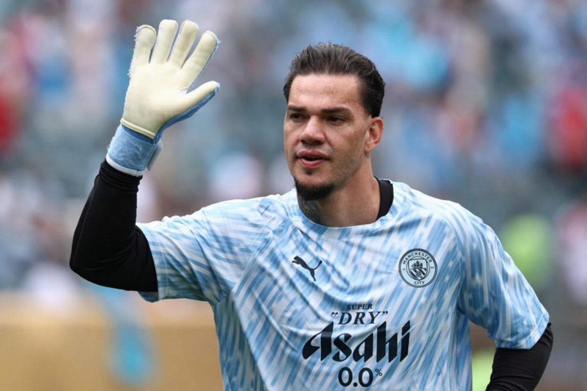 Manchester City's Brazilian goalkeeper #31 Ederson waves prior to the FIFA Club World Cup 2025 Group G football match between England's Manchester City and Morocco's Wydad AC at the Lincoln Financial Field stadium in Philadelphia on June 18, 2025. FRANCK FIFE / AFP