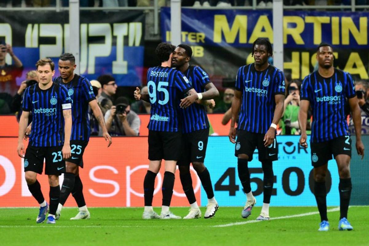 Inter Milan's French forward #9 Marcus Thuram celebrates scoring his team's first goal with Inter Milan's Italian defender #95 Alessandro Bastoni during the Italian Serie A football match between Inter Milan and Parma at San Siro stadium in Milan, on May 3, 2026. Stefano RELLANDINI / AFP