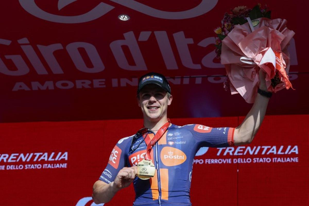 Team Picnic PostNL's Dutch rider Casper Van Uden celebrates on the podium after winning the 4th stage of the 108th Giro d'Italia cycling race 189kms from Alberobello to Lecce on May 13, 2025. Luca Bettini / AFP
