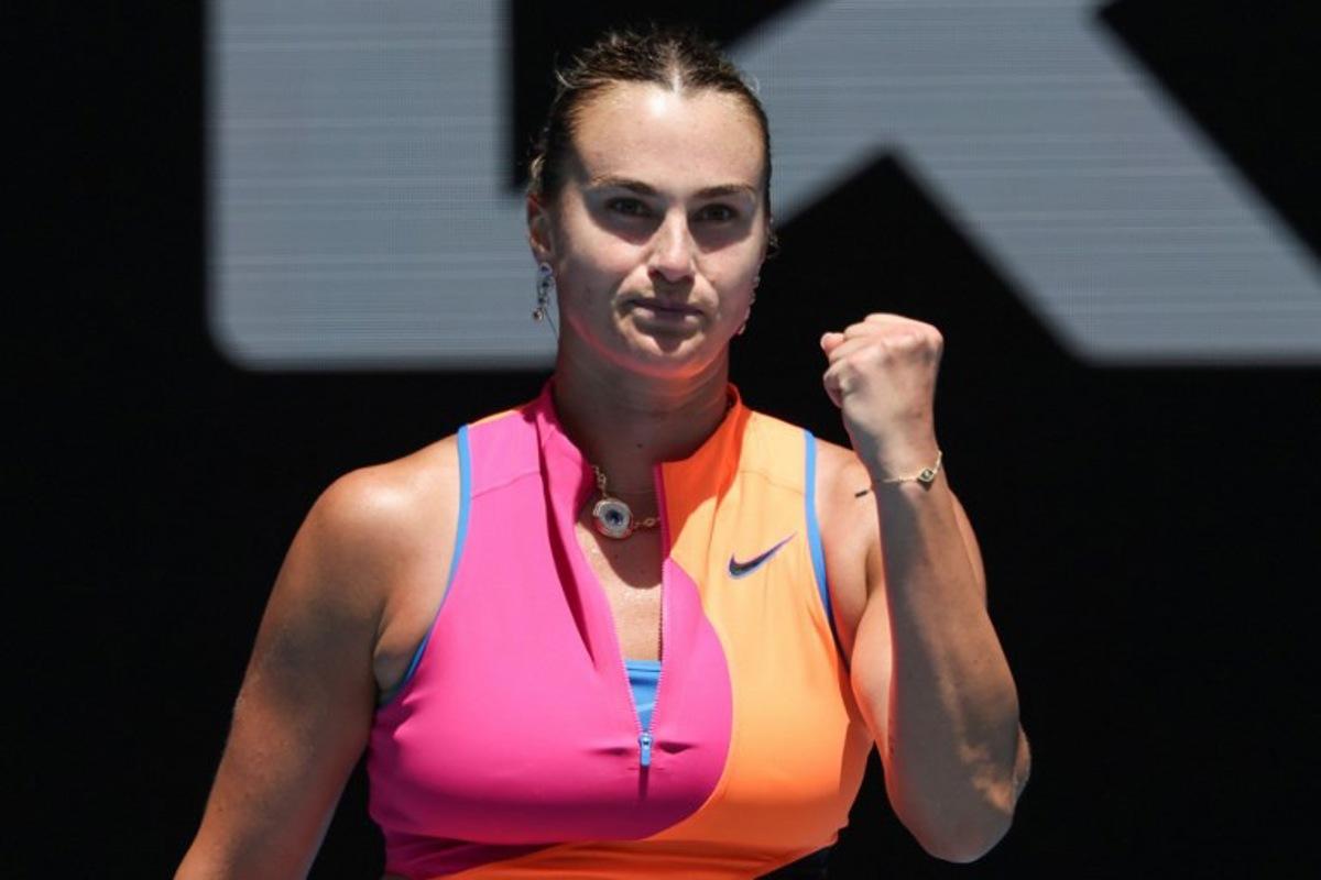 Belarus' Aryna Sabalenka celebrates after victory against Canada's Victoria Mboko during their women's singles match on day eight of the Australian Open tennis tournament in Melbourne on January 25, 2026. DAVID GRAY / AFP