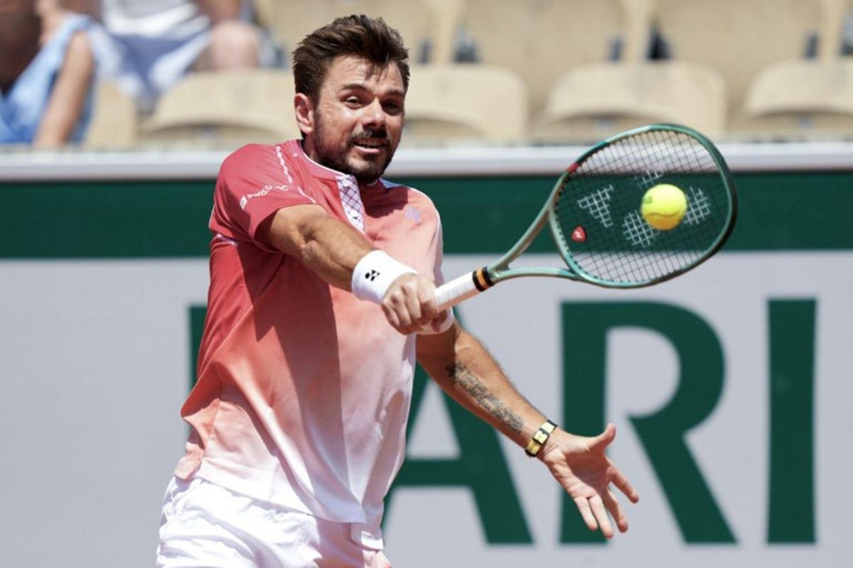 Switzerland's Stan Wawrinka plays a backhand return to Netherlands' Jesper De Jong during their men's singles match on day 2 of the French Open tennis tournament on Court Simonne-Mathieu at the Roland-Garros Complex in Paris on May 25, 2026. Dimitar DILKOFF / AFP