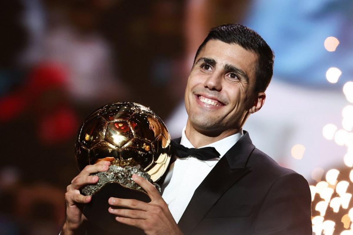 Manchester City's Spanish midfielder Rodri receives the Ballon d'Or award during the 2024 Ballon d'Or France Football award ceremony at the Theatre du Chatelet in Paris on October 28, 2024. FRANCK FIFE / AFP