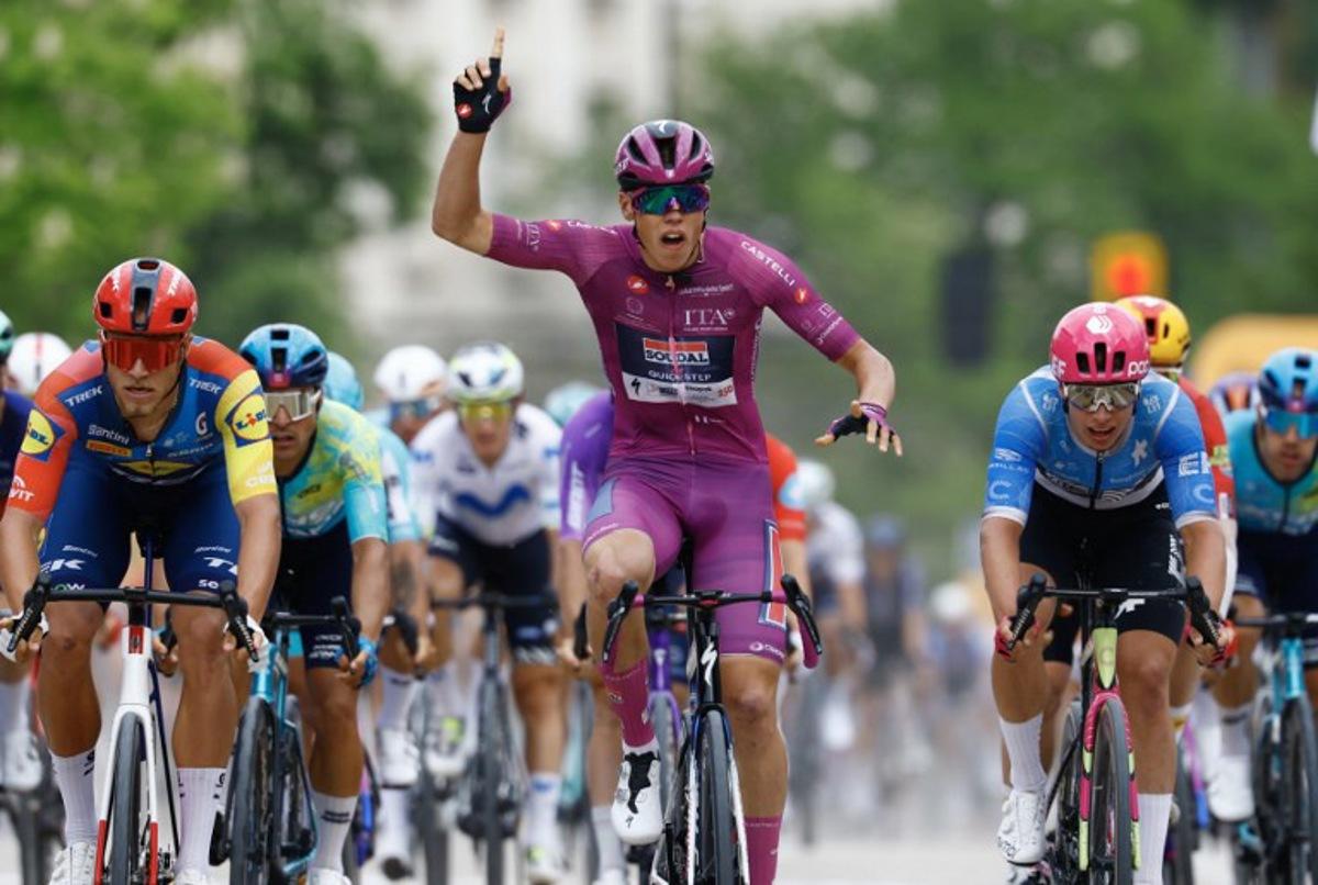 Soudal Quick-Step French rider Paul Magnier wearing the points classification mauve jersey (Maglia Ciclamino) celebrates as he crosses the finish line to win the 3nd stage of the Giro d'Italia 2026 - Tour of Italy cycling race between Plovdiv and Sofia, Bulgaria, on May 10, 2026. Luca Bettini / AFP