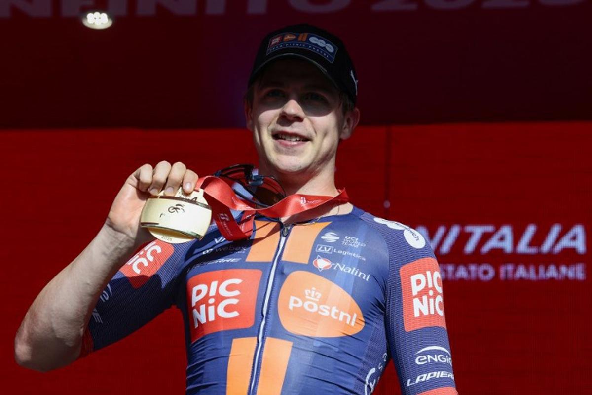 Team Picnic PostNL's Dutch rider Casper Van Uden poses for pictures on the podium after winning the 4th stage of the 108th Giro d'Italia cycling race 189kms from Alberobello to Lecce on May 13, 2025. Luca Bettini / AFP