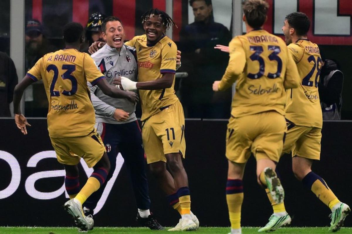 Bologna's Belgian forward #11 Samuel Mbangula celebrates with teammates after scoring a goal during the Italian Serie A football match between AC Milan and Bologna at the San Siro stadium in Milan, northern Italy on October 28, 2026. Marco Bertorello / AFP