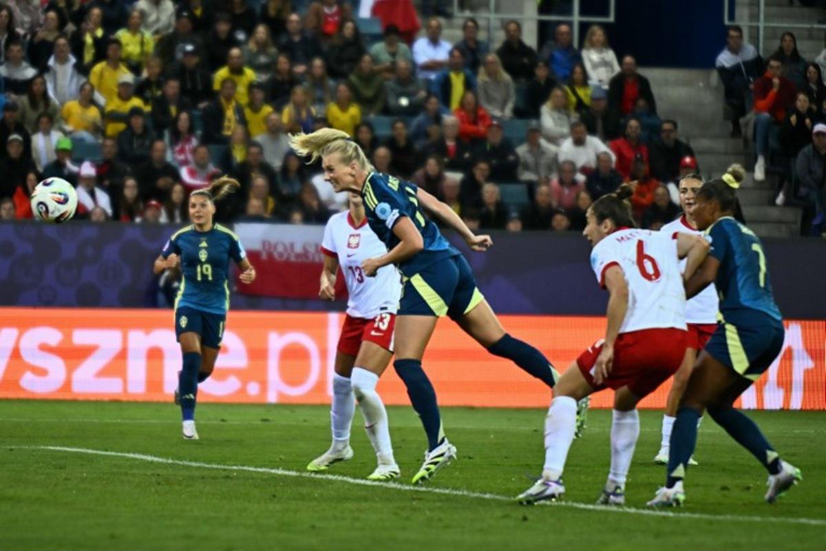 Sweden's forward #11 Stina Blackstenius (C) heads the ball to score Sweden's first goal during the UEFA Women's Euro 2025 Group C football match between Poland and Sweden at the Allmend Stadion Luzern in Lucerne on July 8, 2025. Fabrice COFFRINI / AFP
