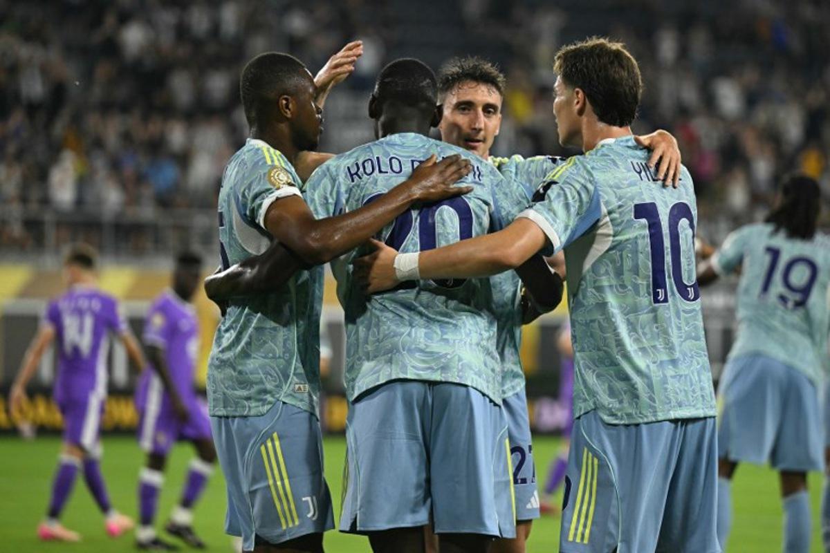 Juventus' French forward #20 Randal Kolo Muani (C) celebrates with teammates after scoring his team's first goal during the FIFA Club World Cup 2025 Group G football match between Italy's Juventus and UAE's Al Ain FC at the Audi Field stadium Washington, DC, on June 18, 2025. ROBERTO SCHMIDT / AFP