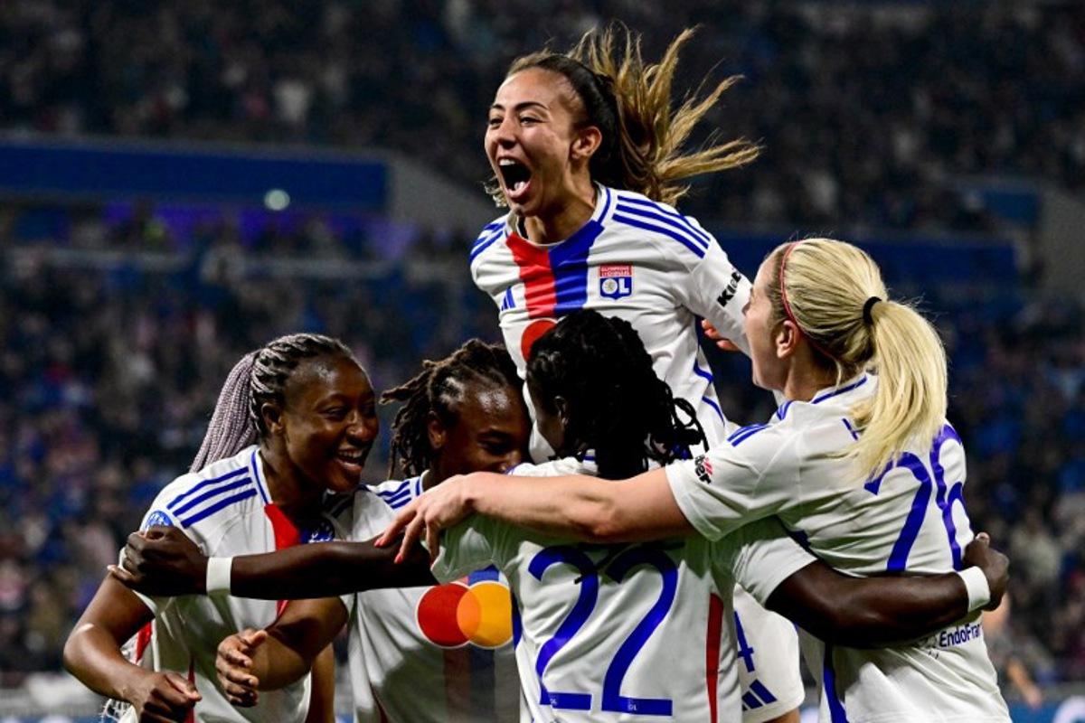 Lyon's French defender #04 Selma Bacha (C) celebrates her team scoring a goal with teammates during the UEFA Women's Champions League quarter final second leg football match between Olympique Lyonnais (FRA) and FC Bayern Munich (GER) at the OL Stadium in Decines-Charpieu, central-eastern France, on March 26, 2025. OLIVIER CHASSIGNOLE / AFP