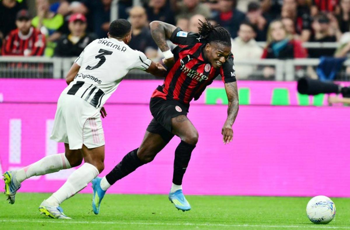 AC Milan's Portuguese forward #10 Rafael Leao (R) fights for the ball with Juventus' Brazilian defender #03 Bremer during the Italian Serie A football match between AC Milan and Juventus FC at the San Siro stadium in Milan, northern Italy, on April 26, 2026. Stefano RELLANDINI / AFP