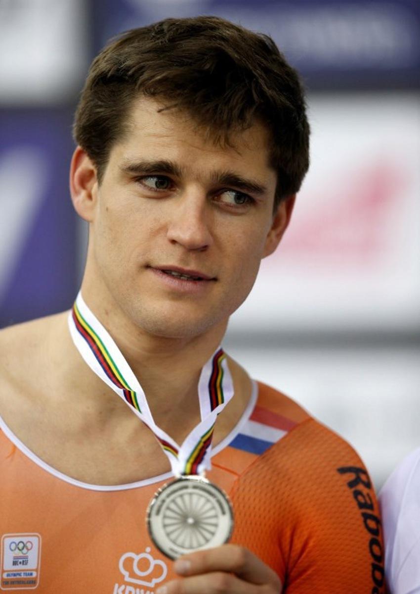 Silver medallist Netherland's Theo Bos poses on the podium after the Men's Kilo TT final during the 2016 Track Cycling World Championships at the Lee Valley VeloPark in London on March 3, 2016 ADRIAN DENNIS / AFP