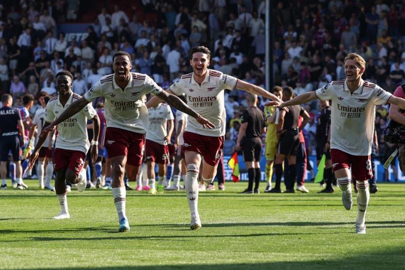Arsenal players celebrate with supporters at the end of the English Premier League football match between Crystal Palace and Arsenal at Selhurst Park in south London on May 24, 2026. Adrian Dennis / AFP