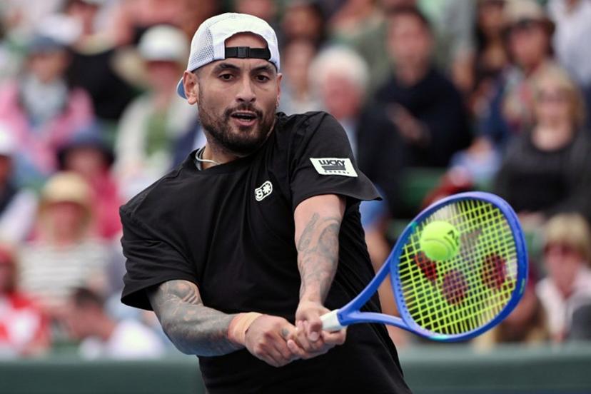 Nick Kyrgios of Australia hits a return during his men's singles match against Zhang Zhizhen of China at the Kooyong Classic tennis tournament in Melbourne on January 13, 2026. William WEST / AFP