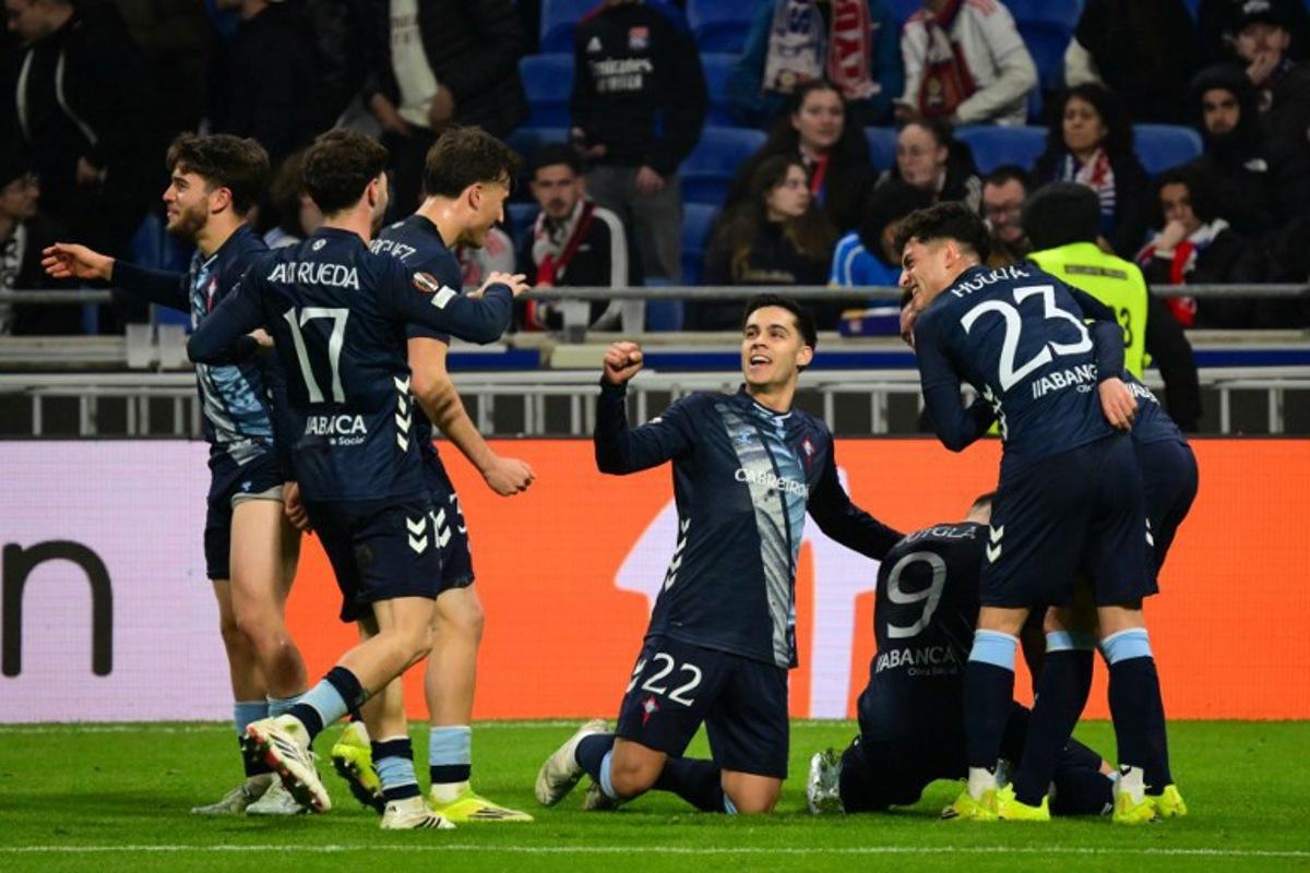 Celta Vigo's players celebrate after Ferran Jutgla scored their second goal during the UEFA Europa League last 16 second leg football match between Olympique Lyonnais (OL) and Celta Vigo at the Groupama Stadium in Lyon, central-eastern France, on March 19, 2026. OLIVIER CHASSIGNOLE / AFP