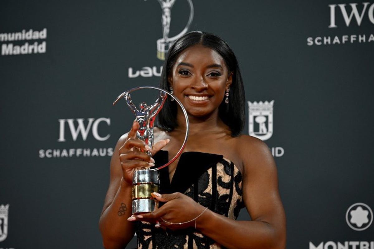 US gymnast Simone Biles poses with her Sportswoman of the Year Award during the 26th Laureus World Sports Awards gala in Madrid on April 21, 2025. JAVIER SORIANO / AFP