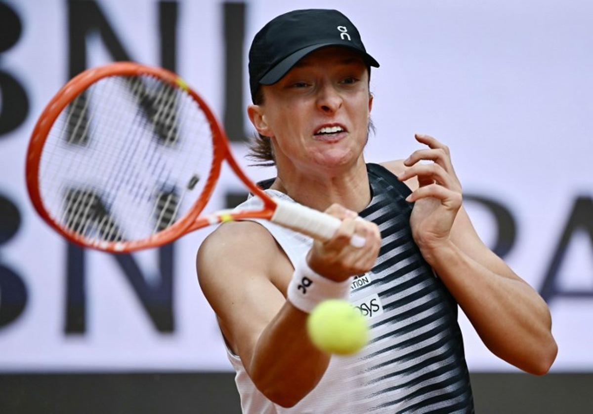 Poland's Iga Swiatek hits a return to USA's Jessica Pegula during the ATP Rome Open tennis tournament at Foro Italico in Rome on May 13, 2026. Filippo MONTEFORTE / AFP