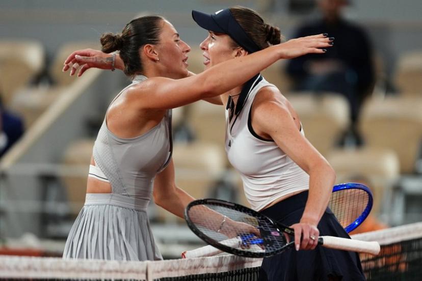 Ukraine's Marta Kostyuk (L) and Ukraine's Elina Svitolina (R) embrace at the end of their women's quarter final singles match on day 10 of the French Open tennis tournament on Court Philippe-Chatrier at the Roland-Garros Complex in Paris on June 2, 2026. Dimitar DILKOFF / AFP