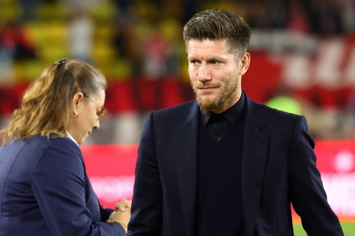 (FILES) Monaco's Belgian head coach Sebastien Pocognoli looks on before the French L1 football match between AS Monaco and RC Lens at the Stade Louis II in the Principality of Monaco on November 8, 2025. Clement MAHOUDEAU / AFP