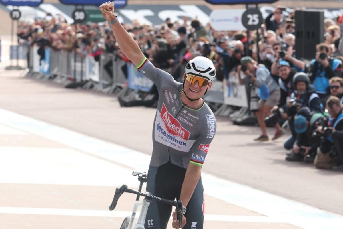 Alpecin-Deceuninck's Dutch rider Mathieu van der Poel celebrates after crossing the finish line to win the 122nd edition of the Paris-Roubaix one-day classic cycling race, 259,2 km between Compiegne and Roubaix, at the Vélodrome André-Pétrieux in Roubaix, northern France on April 13, 2025. Francois LO PRESTI / AFP