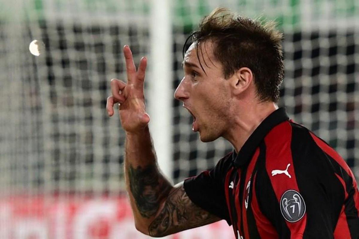 AC Milan's Argentine midfielder Lucas Biglia celebrates after scoring a free kick during the Italian Serie A football match Chievo Verona vs AC Milan on March 9, 2019 at the Marcantonio-Bentegodi stadium in Verona. Miguel MEDINA / AFP