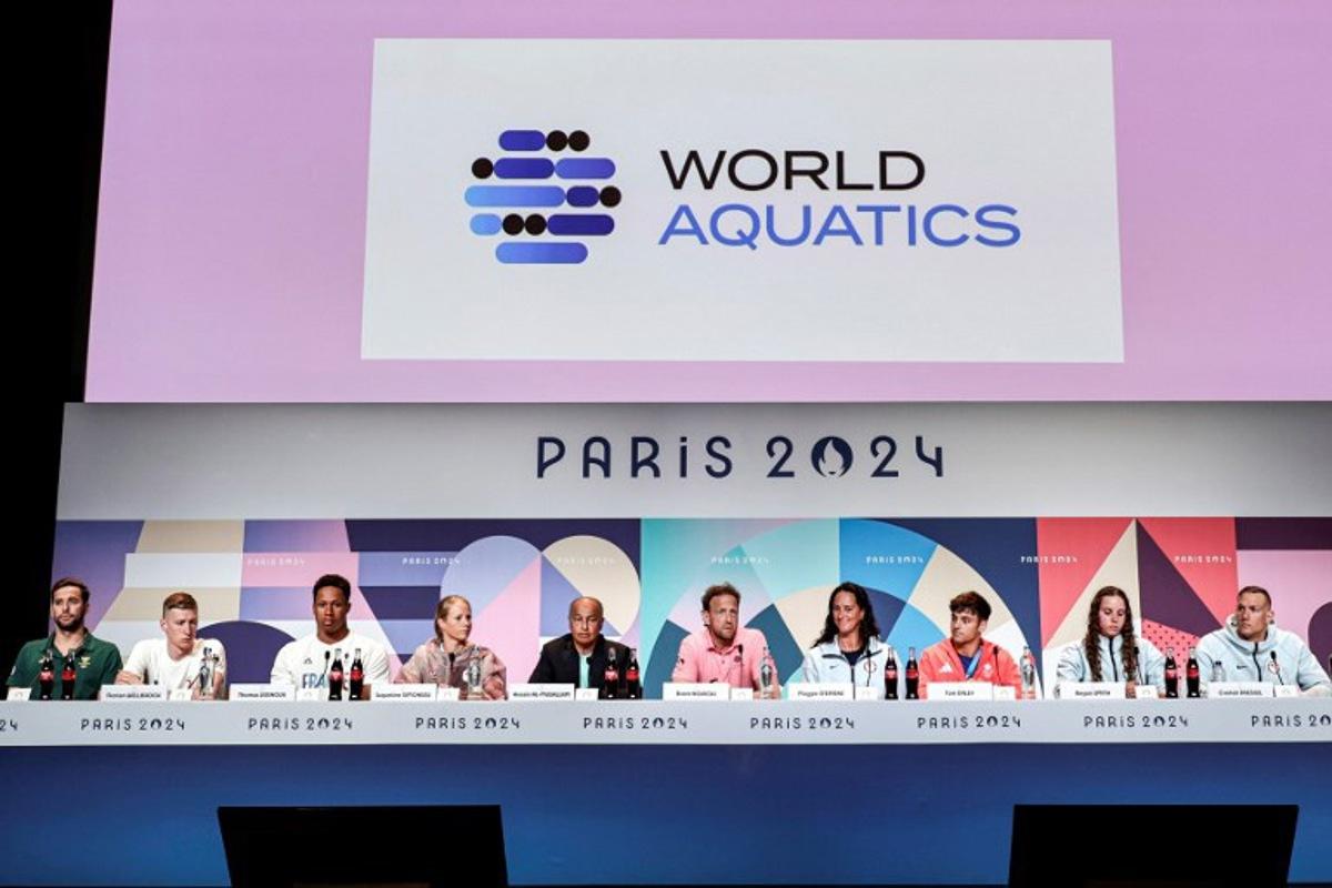 (L to R) South Africa's swimmer Chad Le Clos, Germany's swimmer Florian Wellbrock, France's water polo player Thomas Vernoux, Canada's swimmer Jacqueline Simoneau, World Aquatics President Husain al-Musallam and Executive Director Brent Novicki, US' water polo player Maggie Steffens, Britain's Diver Tom Daley, and US' swimmers Regan Smith and Caeleb Dressel attend the World Aquatics Olympic press conference ahead of the Paris 2024 Olympic Games in Paris, on July 25, 2024. STEPHANE DE SAKUTIN / AFP